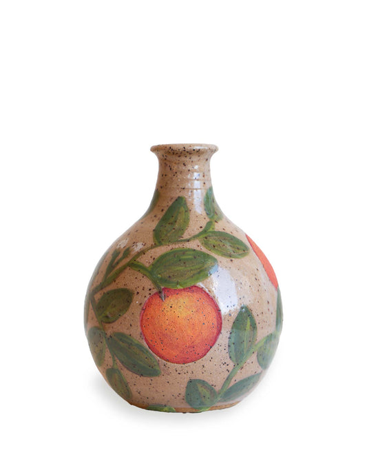Ceramic vase with an orange design on a white background